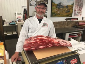 BRUCE BELL/The Intelligencer
Gilmour’s Meat Shop owner Wyatt Whitehead shows some of the beef ribs staff will be serving at the Rossmore store’s first Ribfest on August 25.