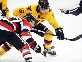 Featuring two of the best uniforms in OHL history, former Belleville Bulls team captain Brendan Gaunce faces-off against an Ottawa 67's foe during an OHL contest at Yardmen Arena in 2011. (Aaron Bell/OHL Images)