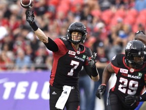 Ottawa Redblacks' Trevor Harris throws the ball against the Winnipeg Blue Bombers during a CFL game in Ottawa on Aug. 4, 2017. (THE CANADIAN PRESS/Justin Tang)