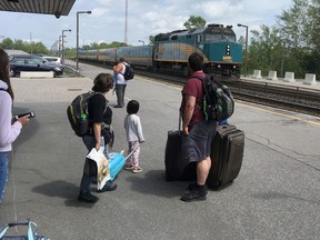 Passengers watch the arrival of a Via Train heading to Toronto in Kingston, Ont. on Wednesday, Aug. 9, 2017. Train service to the city could improve as part of a Via Rail plan.
Elliot Ferguson/The Whig-Standard/Postmedia Network