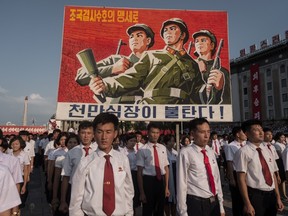 A propaganda poster is displayed during a rally in support of North Korea's stance against the U.S., on Kim Il-Sung square in Pyongyang on August 9, 2017. (KIM WON-JIN/AFP/Getty Images)