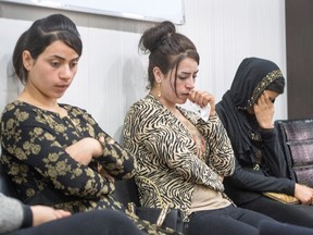 ISIS survivors Suham Haji, left, Samira Hasan, centre, and Saud Khalid, right, sit in the Dohuk Girls and Women Treatment and Support Centre, Wednesday, Feb. 22, 2017 in Dohuk, Iraq. THE CANADIAN PRESS/Ryan Remiorz