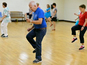 Bob McFarlane, 75, takes part in a line dancing class at London?s Carling Heights Optimist Community Centre. McFarlane says he loves the program because it is good physical and mental exercise. (MORRIS LAMONT, The London Free Press)
