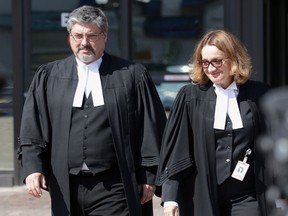 Crown prosecutors Photini Padadatou, right, and Michael Fox arrive to talk with the media outside the courthouse in Lethbridge, Alta. on Wednesday, August 9, 2017. Derek Saretzky, 24, was sentenced to 75 years in prison for three counts of first degree murder in September 2015, of Terry Blanchette, his two-year-old daughter Hailey Dunbar-Blanchette and 69-year-old Hanne Meketch. THE CANADIAN PRESS/David Rossiter