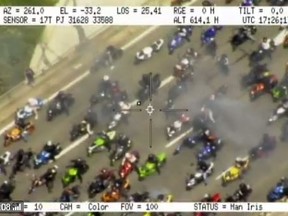 Mob of motorcycles are seen on a Toronto highway in film shot by a police helicopter on Sunday, Aug. 6, 2017.