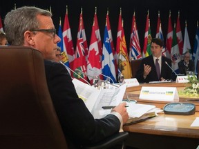 Saskatchewan Premier Brad Wall looks around as Prime Minister Justin Trudeau delivers his remarks for the afternoon session at the First Ministers' Meeting in Ottawa, Friday, December 9, 2016. THE CANADIAN PRESS/Adrian Wyld