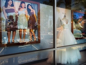 A window display is seen at Alfredo Angelo bridal store in West Covina, Calif., Friday, July 14, 2017. Florida-based bridal retailer Alfred Angelo shuttered its 60 U.S. stores and filed for Chapter 7 bankruptcy liquidation in July, leaving brides-to-be around the world without the gowns they had already ordered. (THE CANADIAN PRESS/AP, Los Angeles Daily News - Walt Mancini)
