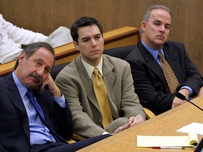 Accused murderer Scott Peterson (C) and defense attorney Mark Geragos (L) listen during prosecution rebuttal to the defense closing arguments in Peterson's capital murder trial November 3, 2004 in Redwood City, California. (Photo by Al Golub-Pool/Getty Images)