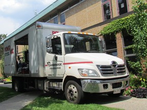 A service truck is parked Thursday July 10, 2017 next to the Sarnia Public Library where cleaning and repairs continue following a small fire July 13 in an electrical transformer at the downtown building. The library has been closed since the fire, but officials hope it can reopen Aug. 21. (Paul Morden/Sarnia Observer/Postmedia Network)