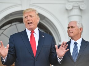U.S. President Donald Trump and Vice President Mike Pence speak to the press on August 10, 2017, at Trump's Bedminster National Golf Club in New Jersey before a security briefing. (NICHOLAS KAMM/AFP/Getty Images)