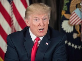 This file photo taken on August 8, 2017 shows US President Donald Trump speaking about North Korea at a meeting with administration officials on the opioid addiction crisis at the Trump National Golf Club in Bedminster, New Jersey.