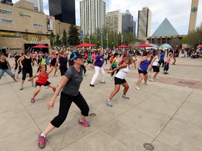 In this file photo, a group of people take in a free Zumba class at Sir Winston Churchill Square in Edmonton, Alberta on Friday, May 23, 2014. (Perry Mah/Edmonton Sun)