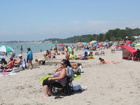 Crowds were out in full force at Port Stanley’s main beach on Thursday afternoon just days after a water advisory was lifted. The village thrives in the summer months as tourists flock to the beaches. (Laura Broadley/Times-Journal)