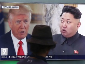 A man watches a television screen showing President Donald Trump and North Korean leader Kim Jong Un during a news program at the Seoul Train Station in Seoul, South Korea, Thursday, Aug. 10, 2017. President Donald Trump issued a new threat to North Korea on Thursday, demanding that Kim Jong Un's government "get their act together" or face extraordinary trouble. He said his previous "fire and fury" warning to Pyongyang might have been too mild. (AP Photo/Ahn Young-joon)
