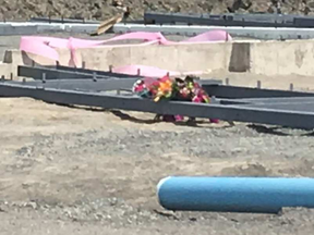 A bouquet of flowers sits at a Gatineau construction site on Thursday, Aug. 10, 2017. OLIVIA BLACKMORE / POSTMEDIA