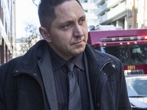 Const. Adam Lourenco leaves Toronto Police headquarters on March 21, 2017. (CRAIG ROBERTSON/Toronto Sun)