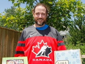 Dana Ogilvie, seen here outside his Westbrook home with his name tag and show souvenir, got to checked off an item from his bucket list by attending and making it onto the popular game show The Price is Right in mid-July. The show will air in early October.  (Julia McKay/The Whig-Standard)