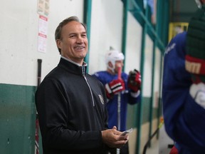 Coach Mike Foligno smiles behind the bench at the NHL vs Docs hockey game in support of the NEO Kids  Foundation in Sudbury, Ont. on Thursday August 10, 2017. Gino Donato/Sudbury Star/Postmedia Network