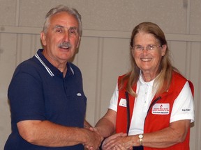 Canadian Blood Services volunteer Marilyn Pollard congratulates Wallaceburg's Joe Everaert for donating blood for his 125th time. Everaert has been donating blood for over 30 years.