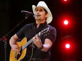 In this June 2, 2017 file photo, Country music recording artist Brad Paisley performs at the graduation for Barrington High School, at Willow Creek Community Church in South Barrington, Ill. Paisley says years of hosting the Country Music Awards and writing songs with humorous lyrics have - hopefully - prepared him to host his first comedy special, the “Brad Paisley Comedy Rodeo,” which will premiere on Netflix on Tuesday, Aug. 15. (Steve Lundy /Daily Herald via AP, File)
