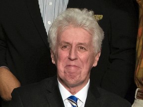 In this Dec. 15, 2016, photo, CNN commentator Jeffrey Lord, appears at a rally for President-elect Donald Trump in Hershey, Pa. CNN cut ties Thursday, Aug. 10, 2017, with Lord, a conservative commentator, after he tweeted a Nazi salute at a critic. (AP Photo/Matt Rourke, File)
