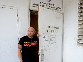 Case Manager Blair Henry shows the back entrance used by clients at the needle exchange program run by the Regional HIV/AIDS Connection in London. (MORRIS LAMONT, The London Free Press)