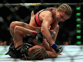 Felice Herrig (black top) and Paige VanZant (pink top) fight in their women's strawweight bout during the UFC Fight Night event at Prudential Center on April 18, 2015 in Newark, New Jersey. (Photo by Alex Trautwig/Getty Images)