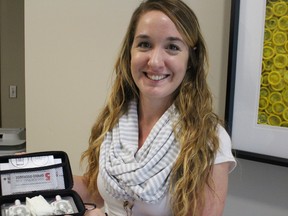 A life-saving drug overdose kit with two nasal-spray applicators of naloxone is shown by Lambton Public Health RPN Casandra Boon. (NEIL BOWEN/Sarnia Observer)