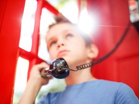 Getty, boy with telephone