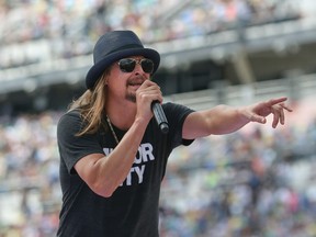 In this photo taken Feb. 22, 2015, singer Kid Rock performs a concert before the Daytona 500 auto race in Daytona Beach, Fla. Steven Law, the head of a super PAC aligned with Senate GOP leadership is encouraging performer Kid Rock to run for Senate against Democratic incumbent Debbie Stabenow of Michigan. (AP Photo/Reinhold Matay)