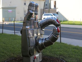 This undated photo shows the sculpture called "Helping Hands" that shows a hand making the OK sign in Trenton, N.J. The sculpture is being relocated after some feared it too closely resembled a gang symbol. Children ages 12 to 15 created the sculpture at a summer camp. The nonprofit organization Isles Inc. says the kids decided on the OK sign because they felt the peace sign was overused. (Cristina Rojas/NJ Advance Media via AP)