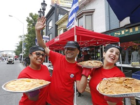 Cristina, Kami and Antoniette with delicacies from Village Pie, spinach and cheese pie in phyllo as they prepare for Taste of the Danforth which starts Friday night and runs through Sunday. It is the 24th edition of the popular food and culture street fest where more than a million mouths gobble up the goodies along the route and listen to music and enjoys the crowds on Friday August 11, 2017. (Michael Peake/Toronto Sun)