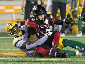 Trevor Harris is hauled down in the second quarter as the Ottawa Redblacks take on the Edmonton Eskimos in CFL action at TD Place in Ottawa on Aug. 10, 2017. (Wayne Cuddington/Postmedia)