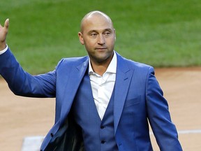 In this May 14, 2017, file photo, former New York Yankees player Derek Jeter waves to fans during a ceremony retiring his number at Yankee Stadium in New York. (AP Photo/Seth Wenig, File)