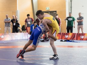 Manuel Nester, 15, of Nunavut (right) broke his arm during a wrestling match with Jason-Guy Luneau of Quebec. (Photo courtesy of Matthew Duboff)