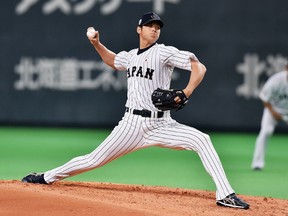 Shohei Otani, here pitching for Japan at the World Cup of Baseball, already has MLB teams making moves to improve their chances of landing him. (Getty Images)