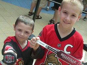 Belleville brothers Noah Phillips, six (left) and Christopher Phillips, 13, were on hand Saturday at Quinte Mall for the AHL Belleville Senators official jersey launch. (Paul Svoboda/The Intelligencer)