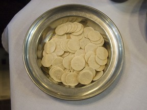 Communion wafers at mass at St Peter's Cathedral Basilica in London, Ont., on Palm Sunday in March 2013.