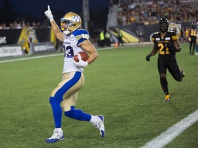 Blue Bombers receiver Julian Feoli-Gudino (left) is all alone in the end zone for a touchdown. (The Canadian Press)