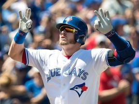 Toronto Blue Jays Josh Donaldson crosses home plate after hitting a two-run home run against the Pittsburgh Pirates in the first inning of their interleague MLB baseball game in Toronto on Sunday, August 13, 2017. (THE CANADIAN PRESS/Fred Thornhill)