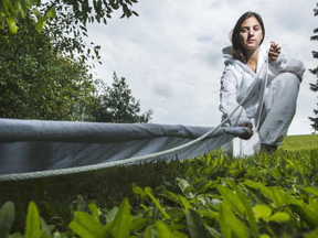 Dr. Manisha Kulkarni, a medical entomologist at the University of Ottawa's School of Epidemiology and Public Health, drags for tics outside the University of Ottawa.