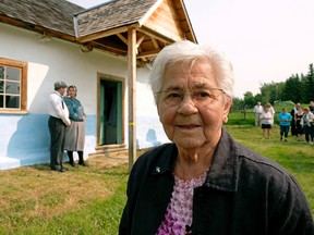 Genia Saik (88-years-old) stands in front of the house where she onced lived. The house was moved from the Innisfree, Alberta area to the new Galician Settlers Farmstead at the Ukrainian Cultural Heritage Village, which was officially opened on Sunday August 13, 2017. (PHOTO BY LARRY WONG/POSTMEDIA)