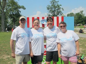 Founding members of S5 Waves, which organizes events for the deaf community in Kingston and area, from left, Marc Heyez, Theresa Upton, Leah Riddell and Kirsten Meyer. The group hosted its first Awesome Ice Cream Social at Lake Ontario Park on Saturday. (Ashley Rhamey/For The Whig-Standard)