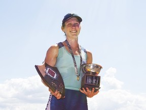 Louise Munro of Kingston poses with her trophy after winning the under-23 women’s single race during the final day of racing at the 135th Royal Canadian Henley Regatta in St. Catharines on Sunday. She won the race by 16 seconds. (Julie Jocsak/Postmedia Network)