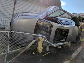 Firefighters had to free a person from a vehicle that had struck a hydro pole and rolled over in the city's east end Sunday.