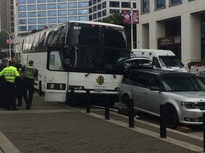 A tour bus outside Canada Place hit at least three pedestrians on Aug. 13, 2017. Two of those sent to hospital were critically injured, according to early reports. (Postmedia Network)