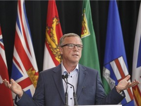 Saskatchewan Premier Brad Wall speaks to media during the Council of Federation meetings in Edmonton on July 18, 2017. THE CANADIAN PRESS/Jason Franson