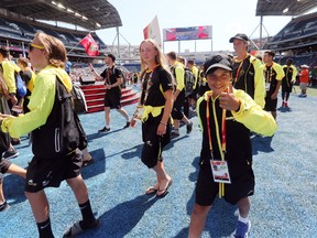 Team Manitoba arrives during the Parade of Athletes at the closing ceremony for the 2017 Canada Summer at Investors Group Field in Winnipeg, Man., on Sunday, August 13, 2017. (Brook Jones/Postmedia Network)