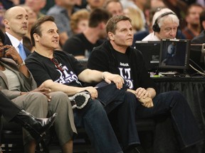 This April 18, 2012 file photo shows Gavin Maloof, left, and his brother Joe, co owners of the Sacramento Kings watching an NBA basketball game against the San Antonio Spurs from their courtside seats in Sacramento, Calif. (AP Photo/Rich Pedroncelli)