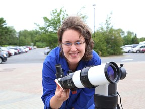 Lucie Robillard, a science communicator at Science North, shows a solar telescope that will be used to view a partial solar eclipse on Aug. 21. The science centre is hosting a solar eclipse viewing from 1 p.m. to 4 p.m. (John Lappa/Sudbury Star)